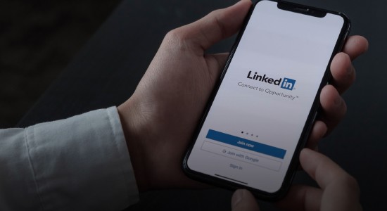 A person signing up for a LinkedIn account on their smartphone