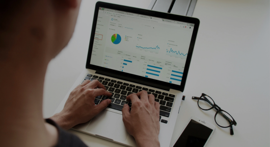 Someone looking at an analytics UI on a laptop.