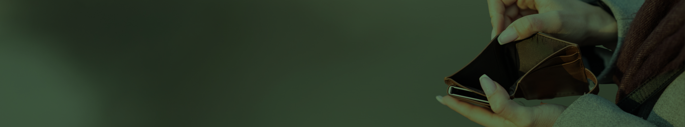 Someone looking into an empty wallet.