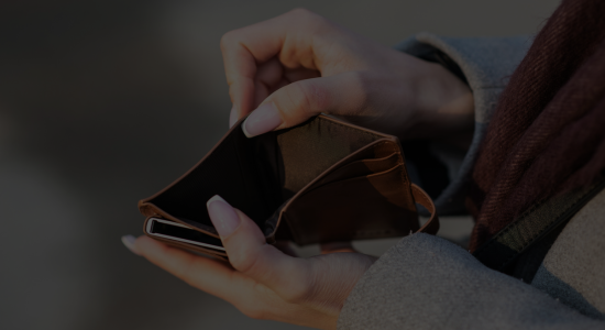 Someone looking into an empty wallet.